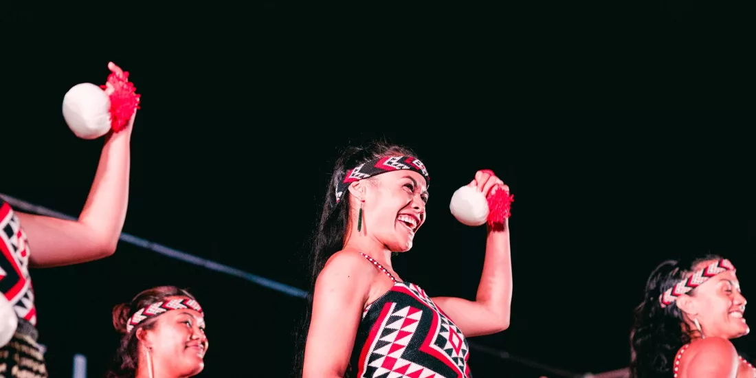 Māori women performing poi dance