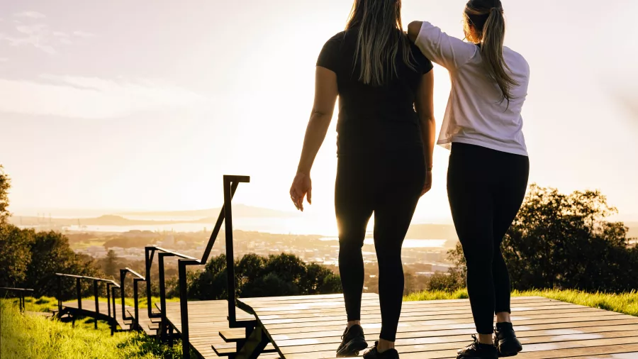 Two women walking on Mount Eden boardwalk