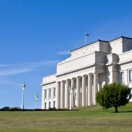 Exterior of Auckland War Memorial Museum with blue sky at Auckland Domain