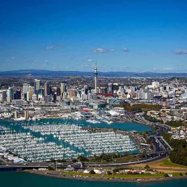 Aerial view of Auckland city skyline and Waitematā Harbour with yachts in Westhaven Marina