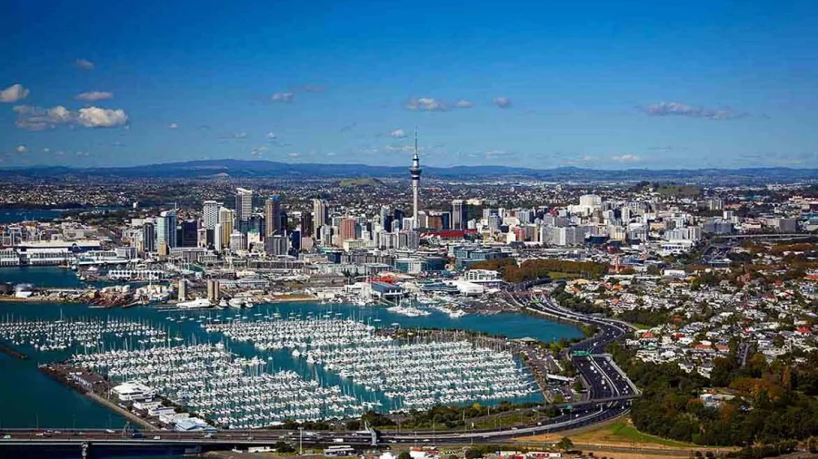 Aerial view of Auckland city skyline and Waitematā Harbour with yachts in Westhaven Marina