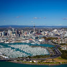 Aerial view of Auckland marina with Sky Tower and CBD in the background