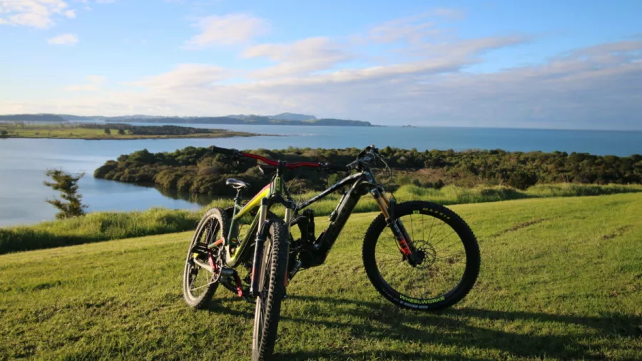 Two e-bikes overlooking coastal views near the Bay of Islands on the Twin Coast Trail
