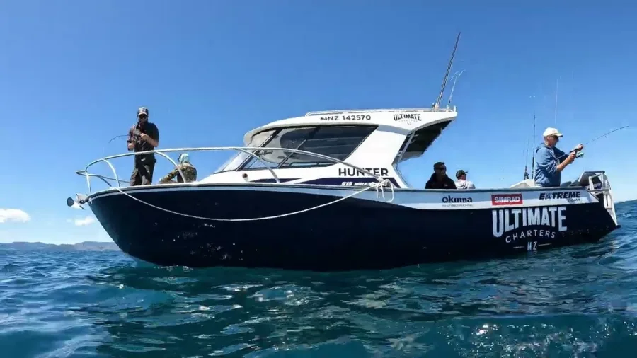 Anglers fishing from Ultimate Charters vessel Hunter in calm blue seas