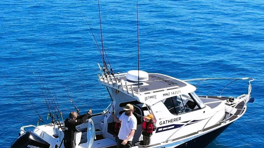 Ultimate Charters vessel ‘Gatherer’ with anglers fishing in deep blue waters