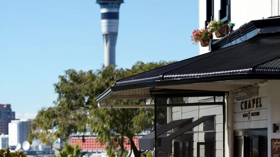 Ponsonby street view with Sky Tower in background