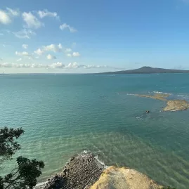 Panoramic coastal view from Achilles Point with Rangitoto Island in the distance