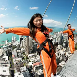 Group doing SkyWalk on Auckland Sky Tower