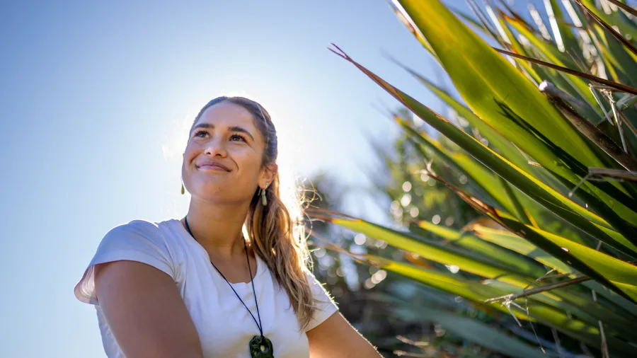 Woman with Harakeke flax in Auckland