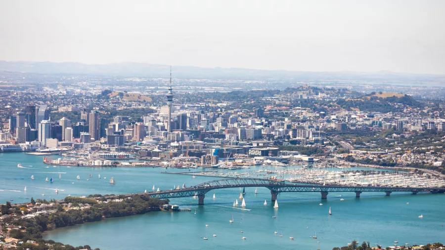 Auckland city and Harbour Bridge with sailing boats