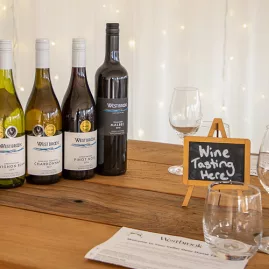 Wine bottles and tasting setup at West Brook Winery in Auckland