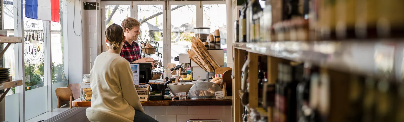 Customer at counter in The Matakana Deli Auckland