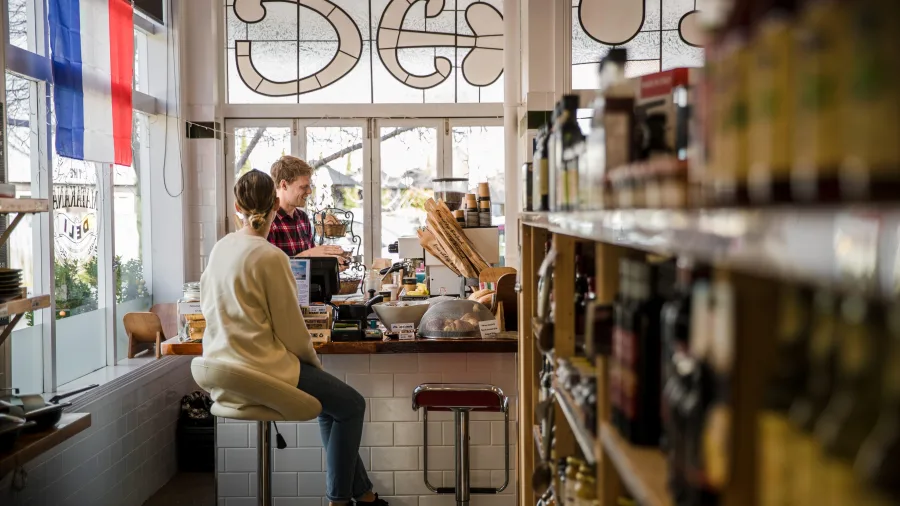 Customer at counter in The Matakana Deli Auckland