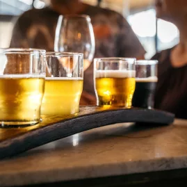 Beer tasting flight at Tantalus Estate on Waiheke Island with artisan ambiance