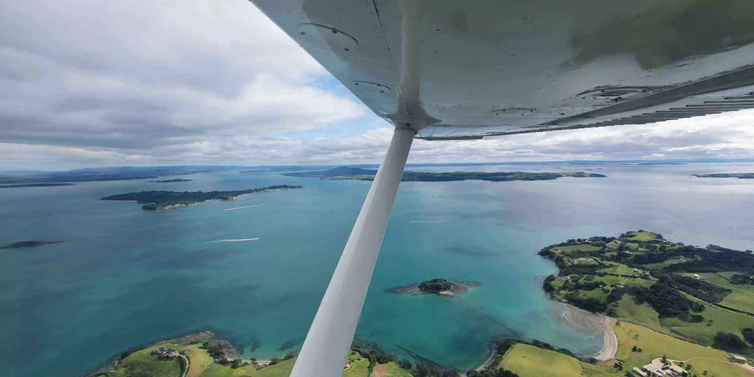 Aerial view of Waiheke Island coastline and Hauraki Gulf from a Cessna 172 aircraft
