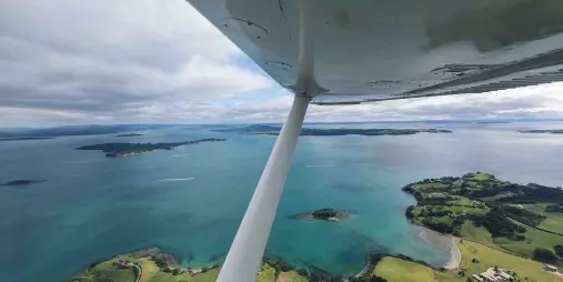 Aerial view of Waiheke Island coastline and Hauraki Gulf from a Cessna 172 aircraft