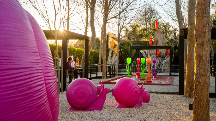 Pink snail sculptures at Sculptureum Matakana