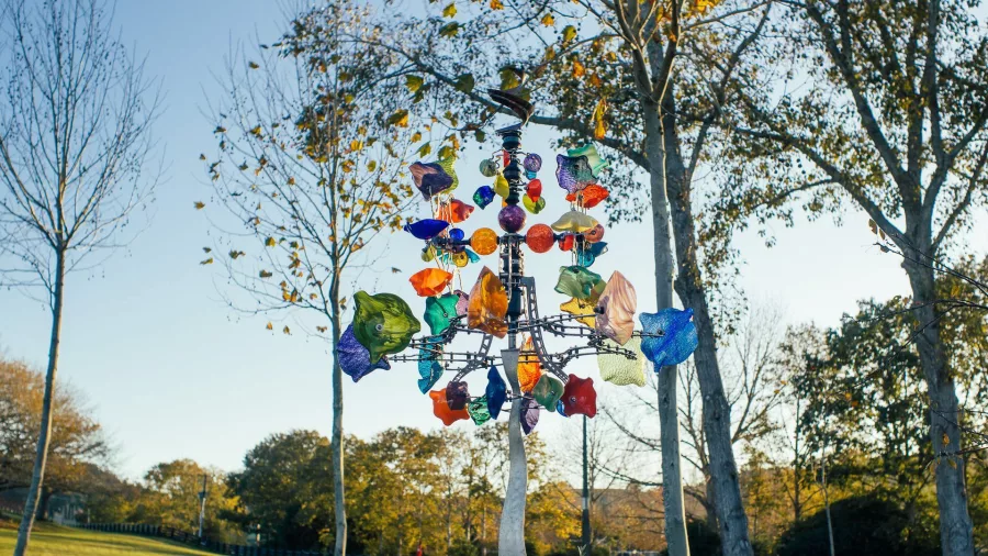 Colourful glass flower sculptures displayed in the Sculptureum gardens at Matakana, New Zealand.