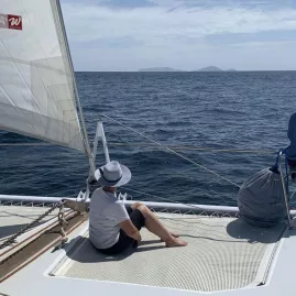 Yacht gliding across the open sea during a scenic sailing journey