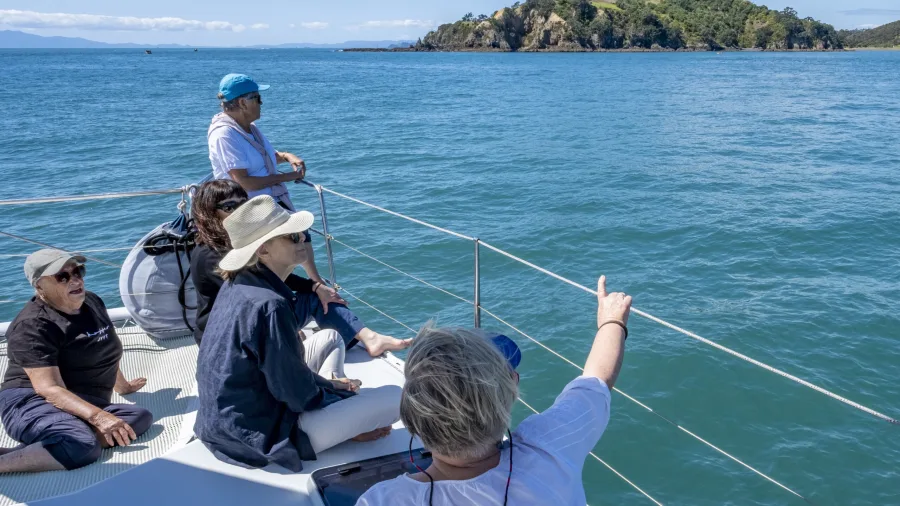 Yacht sailing across open waters during a Waiheke Island sailing adventure
