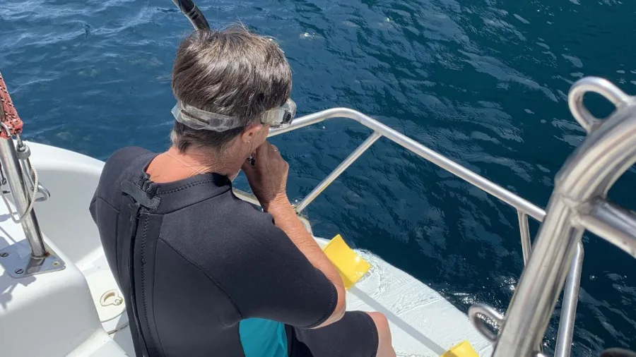 Guest about to go snorkelling in clear blue water during a sailing excursion