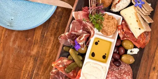 Charcuterie board at Stonyridge Vineyard Waiheke Island with wine