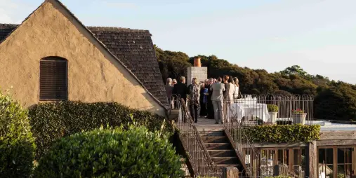 Guests enjoying terrace views at Mudbrick Vineyard Waiheke Island