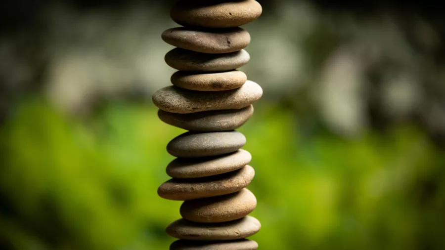 Chris Booth Earth Water Sun sculpture featuring stacked river stones at Brick Bay, Snells Beach