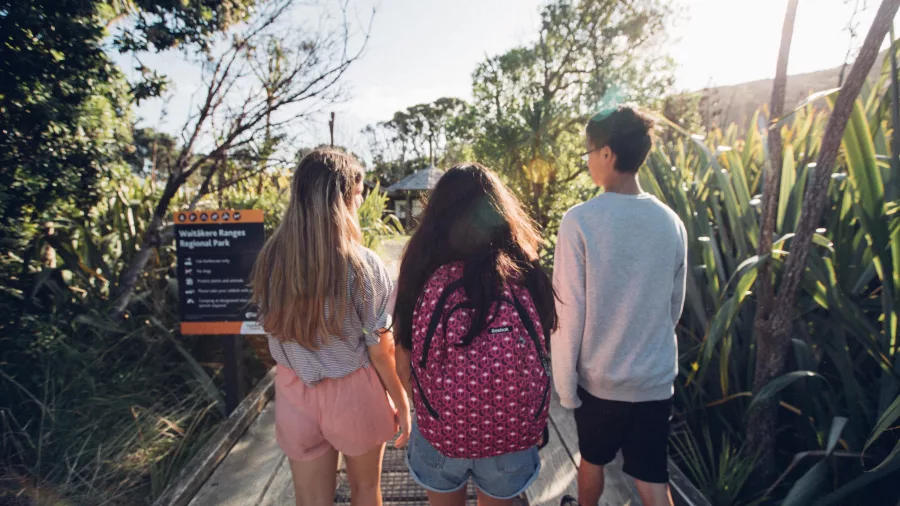 People walking into Waitakere Ranges