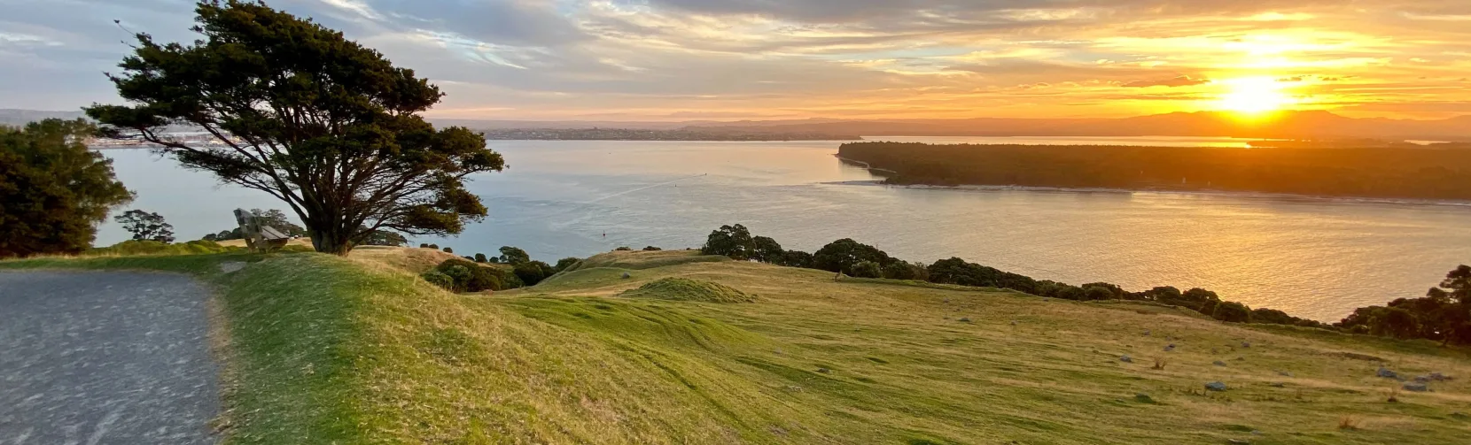 Sunset view from the summit of Mount Maunganui overlooking the Bay of Plenty coastline, New Zealand