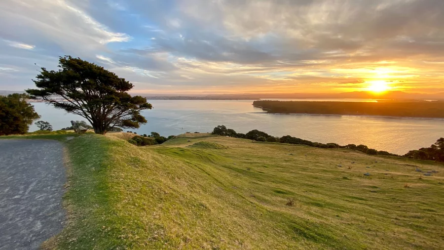 Sunset view from the summit of Mount Maunganui overlooking the Bay of Plenty coastline, New Zealand