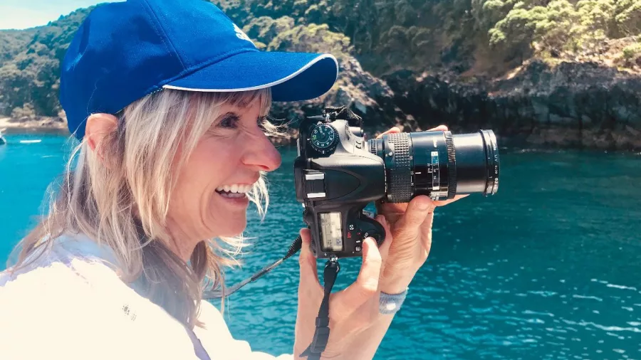 Guest taking wildlife photos from the deck