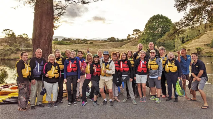 Group of adults wearing life jackets, ready for the Evening Glowworm Kayak Tour