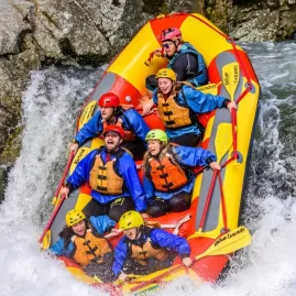 Raft plunging over a steep Grade 5 drop on the Wairoa River with Kaituna Cascades.