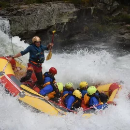 Rafting crew dropping into a powerful rapid on the Wairoa River