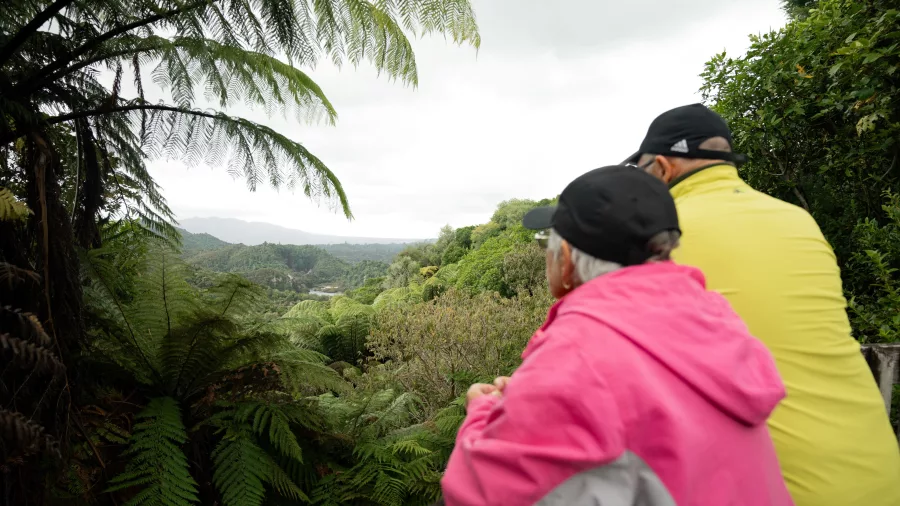 Two visitors taking in the panoramic views over Waimangu Volcanic Valley near Rotorua.