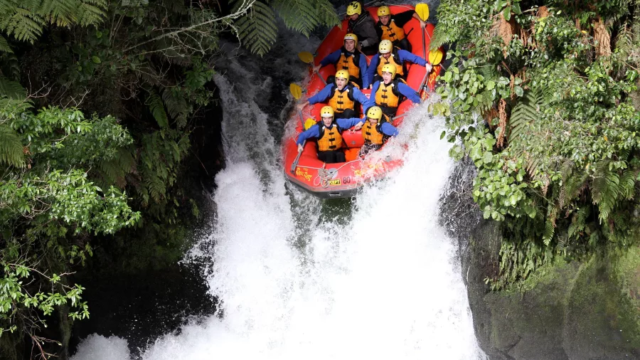 Rafters plunging down Tutea Falls with River Rats on the Kaituna River, Rotorua.