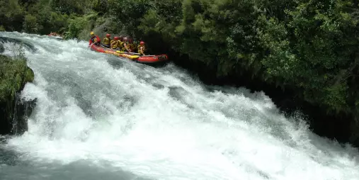 Raft heading down a waterfall-style drop on the Upper Rangitāiki River.