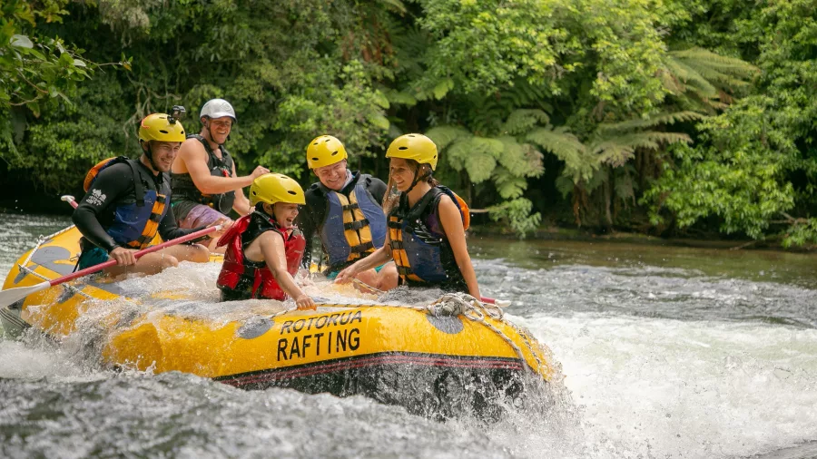 Group enjoying white water rapids with Rotorua Rafting on the Kaituna River