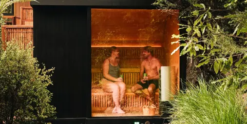 Couple enjoying a private Japanese hinoki wood sauna at Secret Spot Rotorua