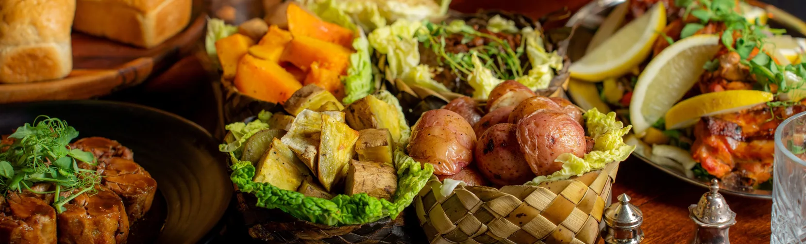 Traditional Māori vegetables like kūmara and taro served in woven flax basket at Te Pā Tū