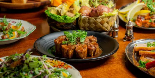 Contemporary Māori feast with beautifully presented dishes at Te Pā Tū