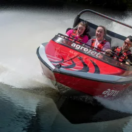 Close-up of excited passengers riding Agrojet at Velocity Valley in Rotorua
