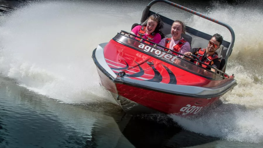 Close-up of excited passengers riding Agrojet at Velocity Valley in Rotorua