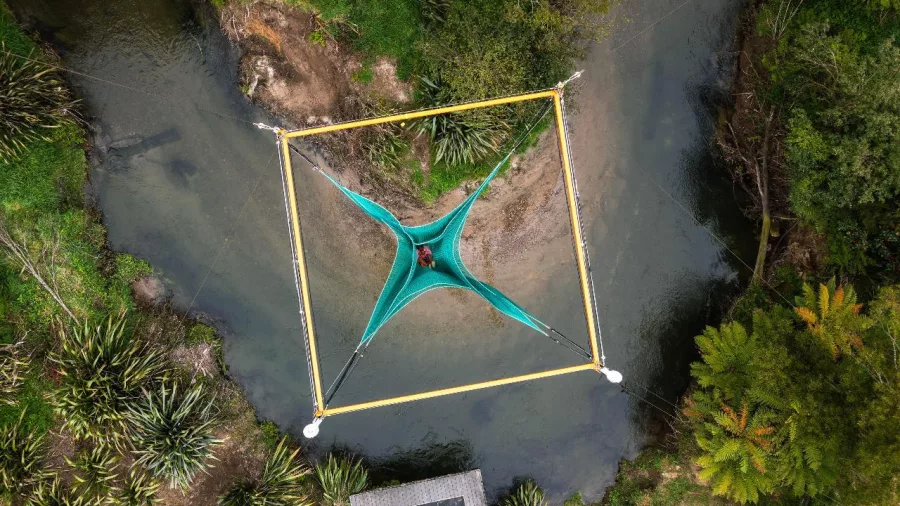 Top-down image of a person lying safely in the centre of Vertigo’s suspended net