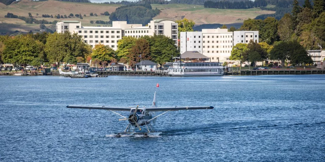Volcanic Air floatplane departing the Lake Rotorua jetty for a scenic flight