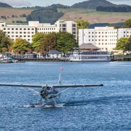 Volcanic Air floatplane departing the Lake Rotorua jetty for a scenic flight