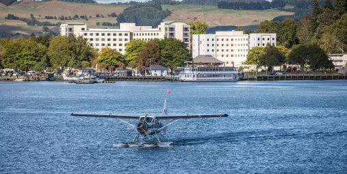 Volcanic Air floatplane departing the Lake Rotorua jetty for a scenic flight