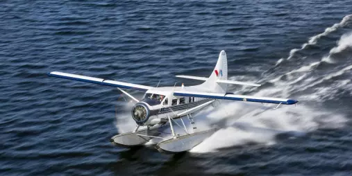 Volcanic Air floatplane skimming across Lake Rotorua as it takes off