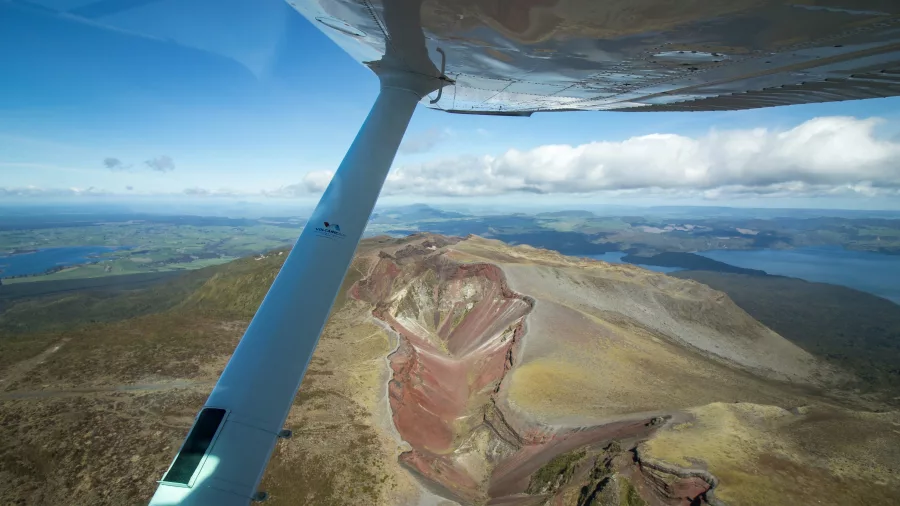 Passenger’s view from floatplane wing looking down over Mount Tarawera’s volcanic crater
